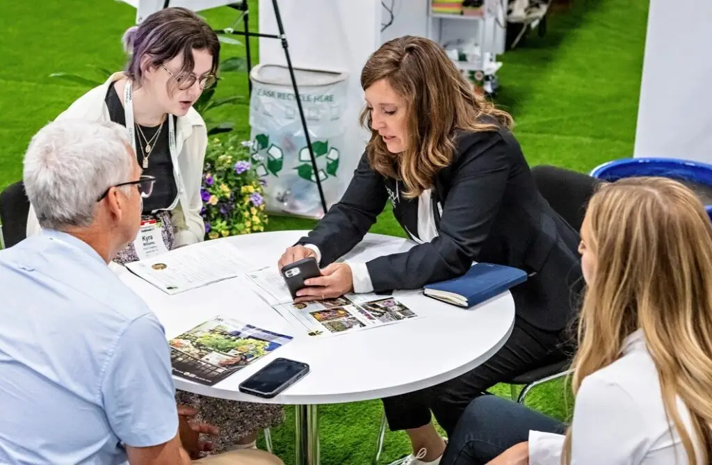 Horticulture professionals meeting during an event to network and conduct business.