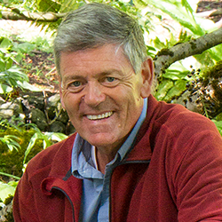 Nicholas Staddon - man wearing a red shirt smiling