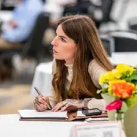 Woman taking notes at Cultivate