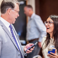 Image of two people talking and networking at an AmericanHort event